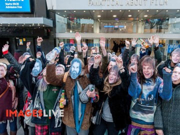 Fans wearing Leonardo DiCaprio masks celebrated the star's Oscar win by watching the movies Titanic and Romeo and Juliet in the Odeon Cinema in Leicester Square. After the late night movie marathon, the fans spilled out onto the street and took selfies.