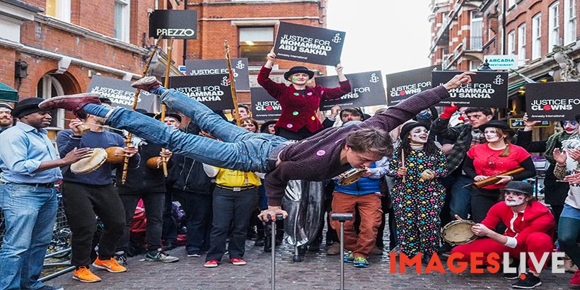 Clowns, jugglers, stilt-walkers, a fire artist and acrobats from Amnesty International performed outside the Israeli embassy in London to protest against the arrest and detention without charges or trial of 23 year old Mohammad Abu Sakha, a performer and trainer with the Palestinian Circus School, training children in circus acts - especially children with learning difficulties - who was detained by Israeli soldiers at a checkpoint on 14 December on his way from his parents’ home in the occupied West Bank city of Jenin to work at the circus school in Birzeit near the city of Ramallah. Friends and relatives of Abu Bakar are increasingly concerned for his safety, as they are not allowed to see or speak to him.

Israel authorities - who claim that the circus clown poses "a security risk to the region" - have placed Abu Sakha under “administrative detention” orders and he is being denied the right to defend himself. Any evidence used to justify his detention is withheld from both Abu Sakha and his lawyers. The Palestinian Circus School denies that Abu Sakha is in any way a threat, saying his only crime is “making children happy” and insists that his life is dedicated to the circus.