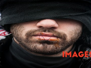 Jungle, Calais, France. 02 March, 2016. A group of Iranian refugees sew up their mouths to signify that their voices are not being heard by the French authorities demolishing the Calais Jungle camp in Northern France.