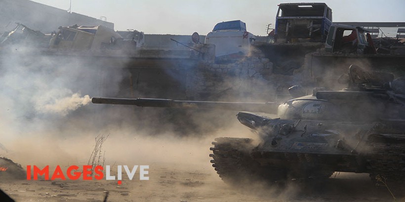 A Free Syrian Army tank firing during a heavy battle to break the siege of Aleppo