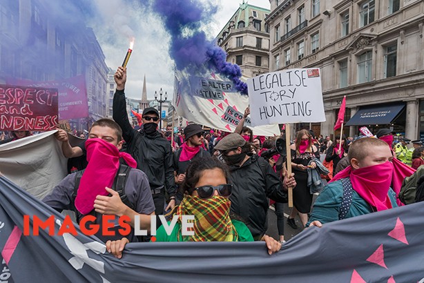 London, UK. 1st July 2017. A large march met at the BBC and marched to Parliament Square calling for Theresa May and the Conservatives to go, included an autonomous bloc who set off flares. May's snap election failed to deliver a majority and we now have a government propped up the DUP, a deeply bigoted party with links to Loyalist terrorists and bribed to support her. The election showed a rejection of her austerity austerity policies and the Grenfell Tower disaster underlined the toxic effects of Tory failure and privatisation of building regulations and inspection and a total lack of concern for the lives of ordinary people. The protesters, many of whom chanted their support of Jeremy Corbyn, say the Tories have proved themselves unfit to govern. They demand a decent health service, education system, housing, jobs and living standards for all. Peter Marshall ImagesLive