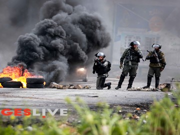 Palestinian protesters clash with Israeli security forces during a demonstration commemorating Land Day near the Israeli settlement of Beit El in the West Bank, following ‘Land Day’ demonstrations. ‘Land Day’ marks the killing of six Arab Israelis during 1976 demonstrations against Israeli confiscations of Arab land