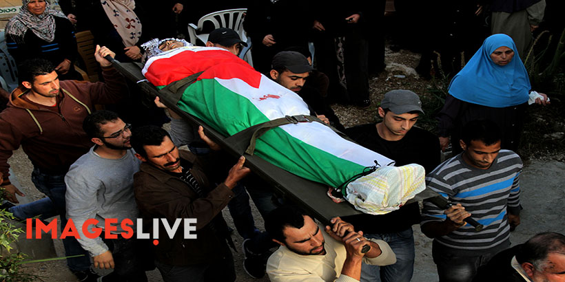Palestinian Territory - Mourners carry the body of Palestinian Ahmad Aamer, 16, who the Israeli military said was shot dead by Israeli soldiers after he tried to stab them, during his funeral in the West Bank village of Mas'ha near Salfit March 9, 2016./Mohammed Turabi