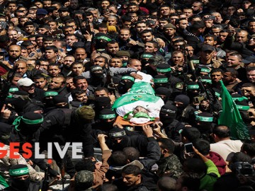 Members of the Ezzedine al-Qassam Brigades, the military wing of the Palestinian Islamist movement Hamas, carry the body of Hamas official, Mazen Faqha, during his funeral in Gaza City. Senior Hamas official Mazen Faqha, who had been freed from Israeli detention in a 2011 prisoner swap, was shot and killed by unknown gunmen in Gaza the day before his funeral. Faqha had been released after eight years in jail, along with more than 1,000 other Palestinians, in exchange for Gilad Shalit, an Israeli soldier Hamas had detained for five years